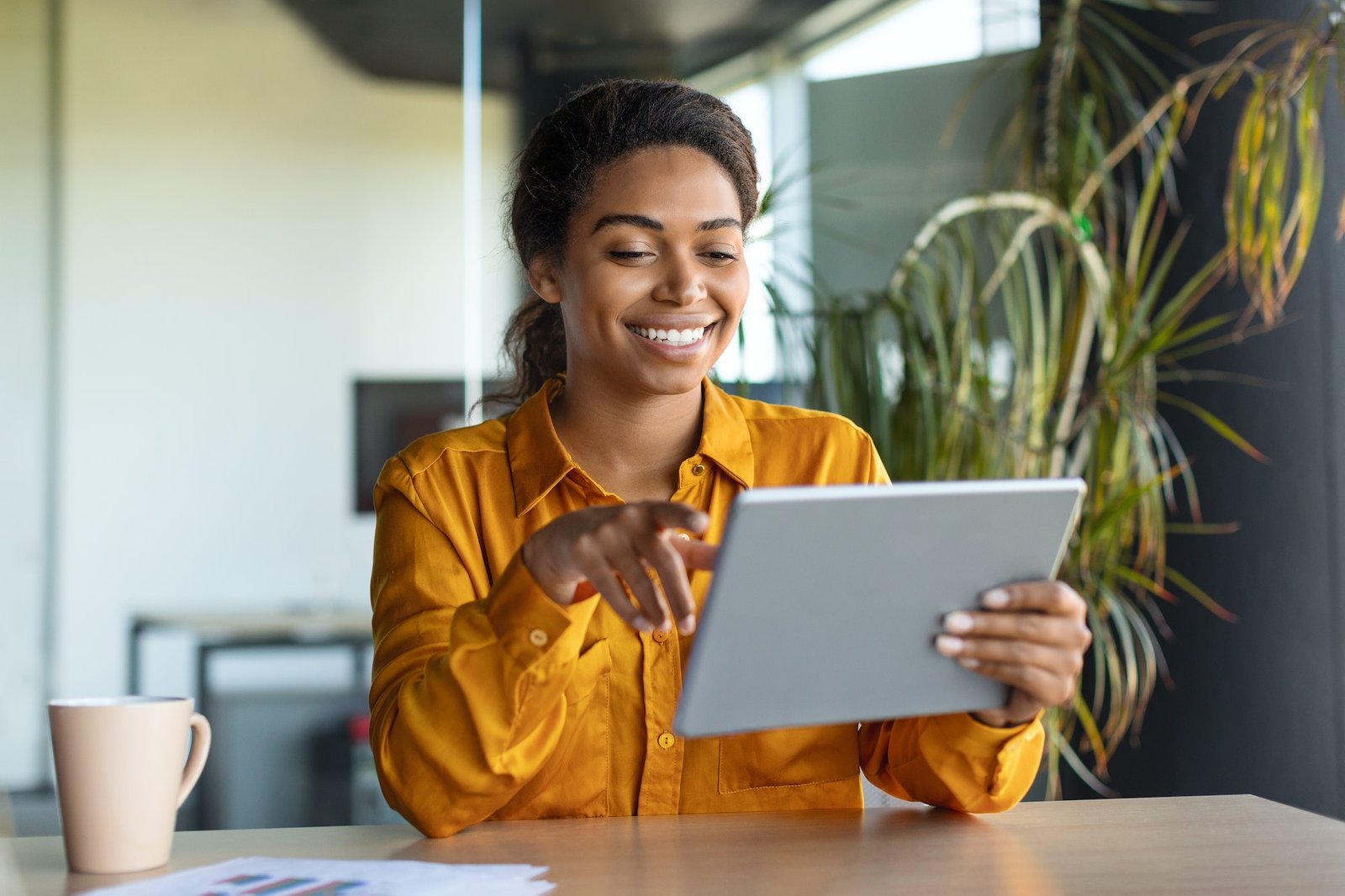 modern technologies in business happy black businesswoman using modern digital tablet working